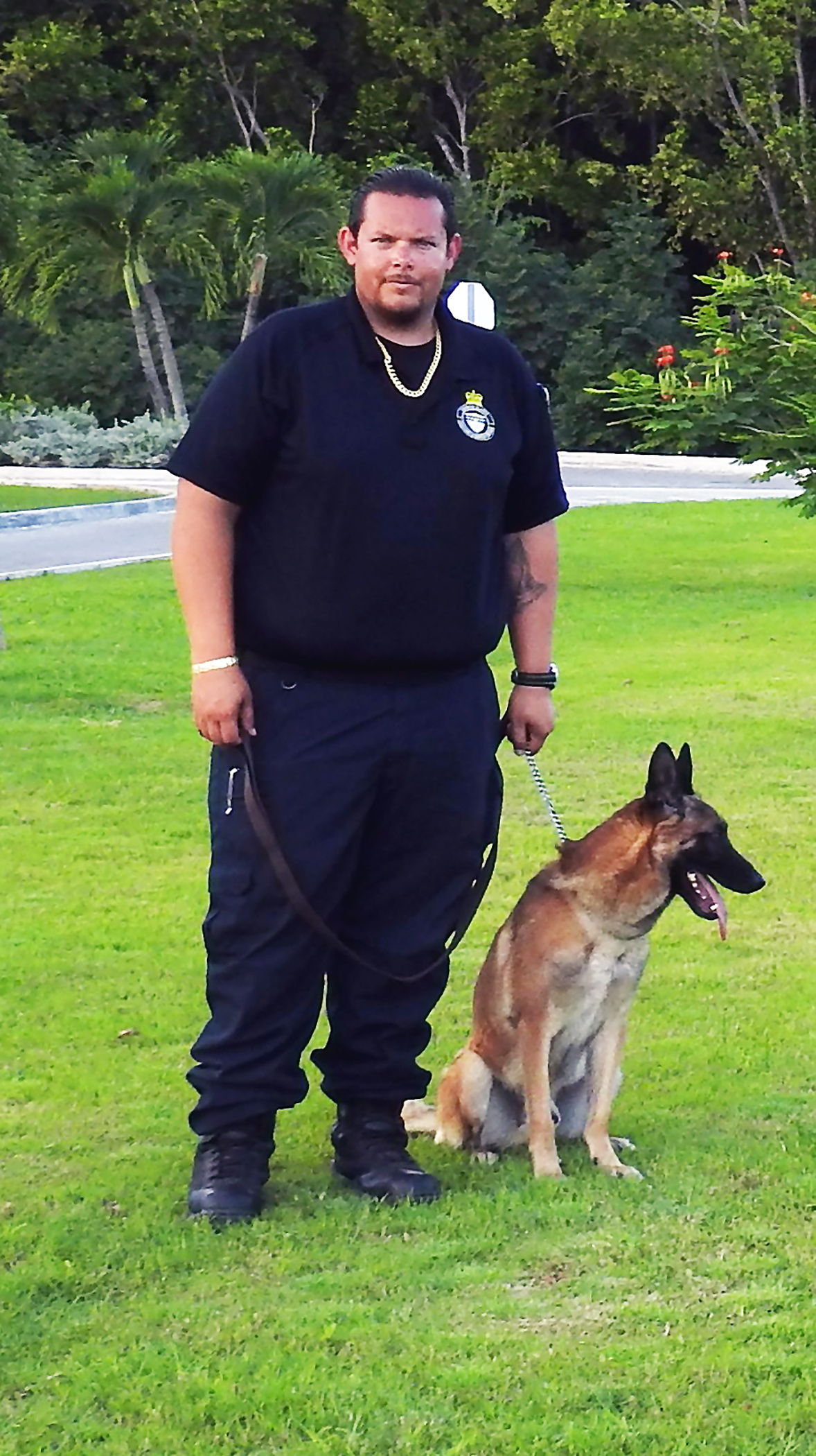 CBC Officer Anthony Echenique with canine Sjoerd, a Belgian Malinois