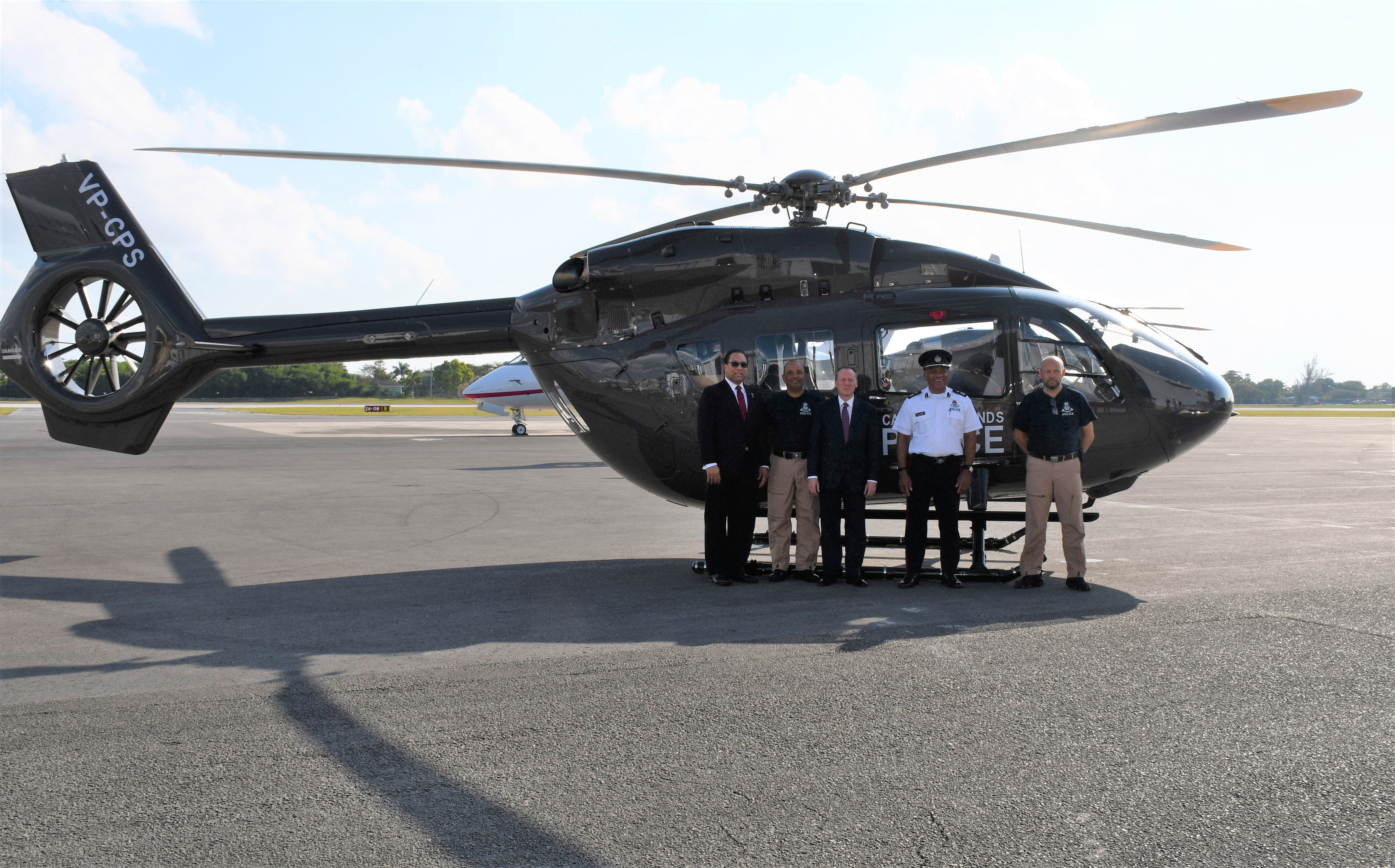 5. Governor, Premier and RCIPS Air Operations Unit with new helicopter