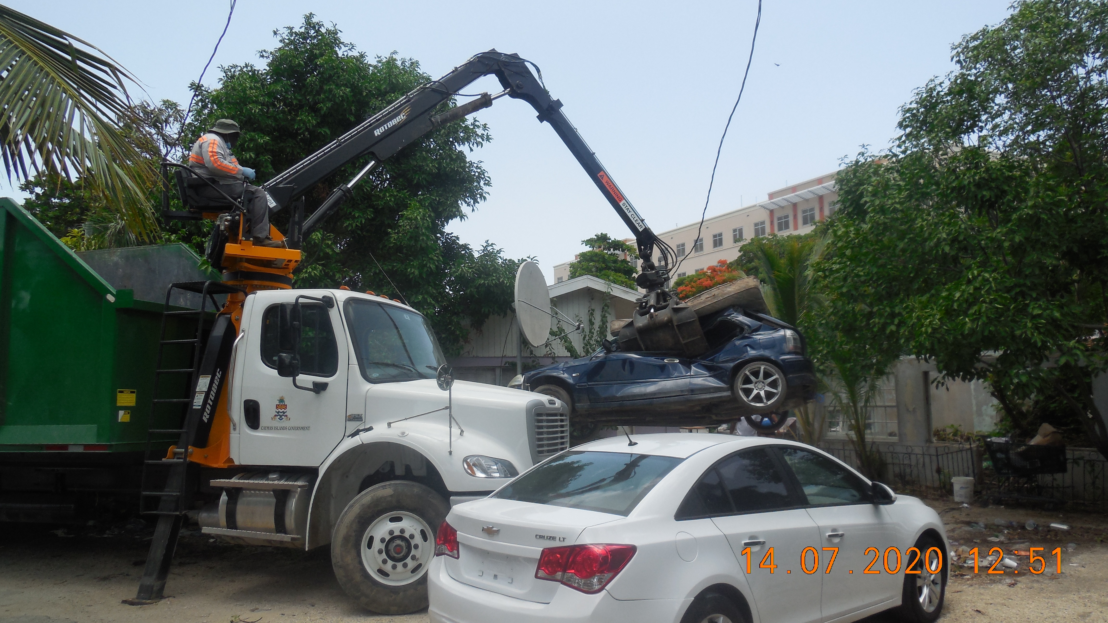 Neighborhood Clean up - DEH staff removes derelict vehicle